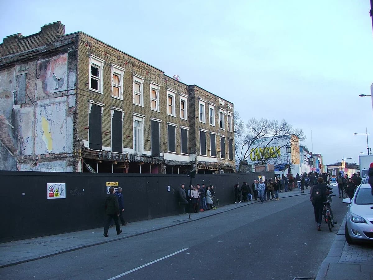 Street scene on Chalk Farm Road in Camden, London, with old buildings and pedestrians.